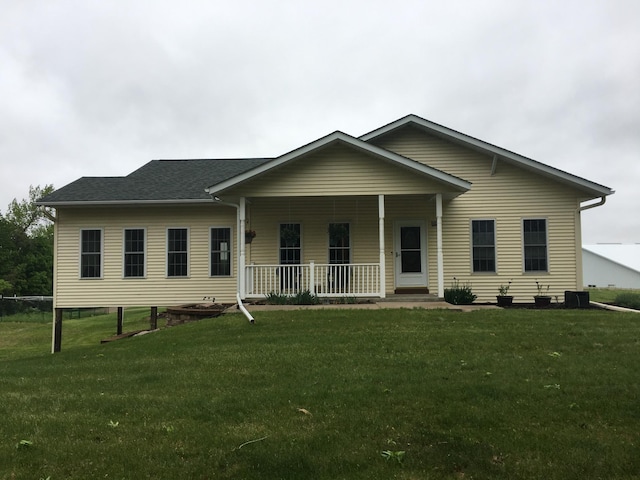 39937 Buchanan St NE, Stanchfield Twp, MN 55080 - view of front facade with covered porch, a front lawn, and roof with shingles