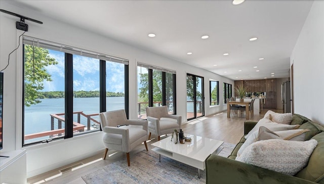 1219 Latoka Dr SW, Alexandria, MN 56308 - living area with recessed lighting, light wood finished floors, and a water view