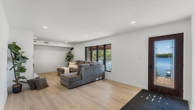 1219 Latoka Dr SW, Alexandria, MN 56308 - living area with light wood-style floors, recessed lighting, and baseboards