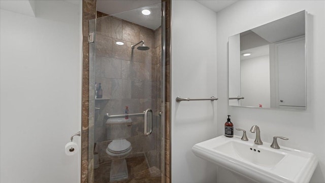 1219 Latoka Dr SW, Alexandria, MN 56308 - full bathroom with a sink, a stall shower, and toilet