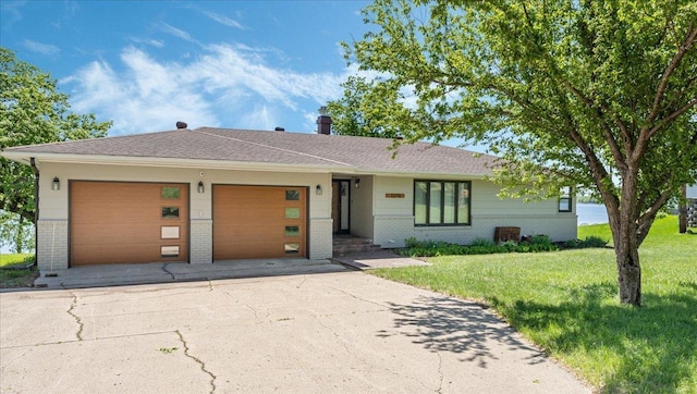 1219 Latoka Dr SW, Alexandria, MN 56308 - ranch-style house with brick siding, a garage, a front yard, and driveway