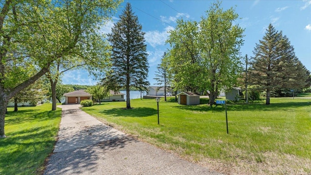 1219 Latoka Dr SW, Alexandria, MN 56308 - view of front of property featuring driveway, a front lawn, and an attached garage