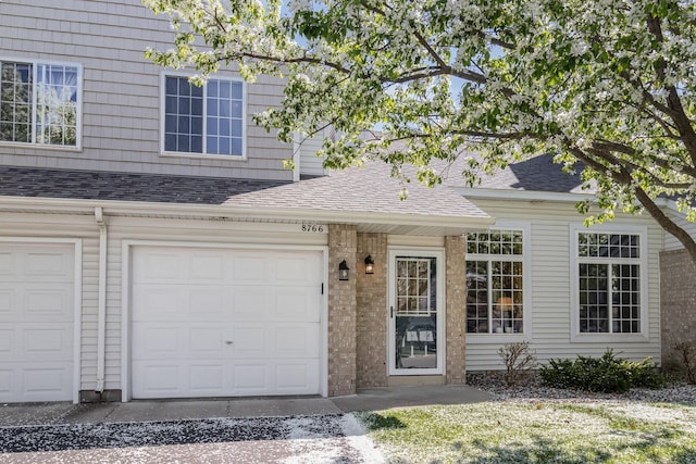8766 Benson Way Unit 84, Inver Grove Heights, MN 55076 - view of front of house with roof with shingles and a garage
