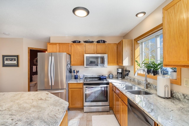 8766 Benson Way Unit 84, Inver Grove Heights, MN 55076 - kitchen with stainless steel appliances, a sink, and light stone counters