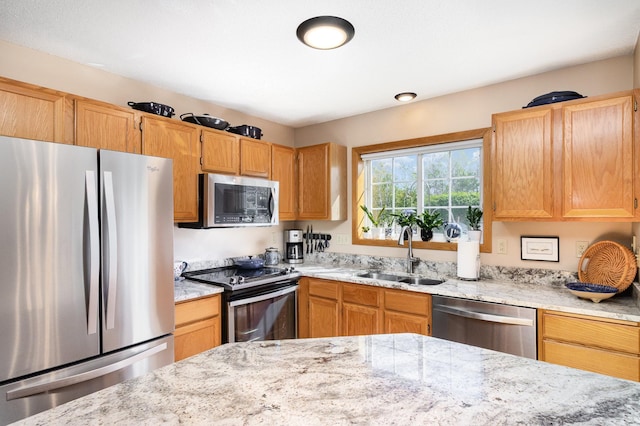 8766 Benson Way Unit 84, Inver Grove Heights, MN 55076 - kitchen with stainless steel appliances, a sink, and light stone countertops