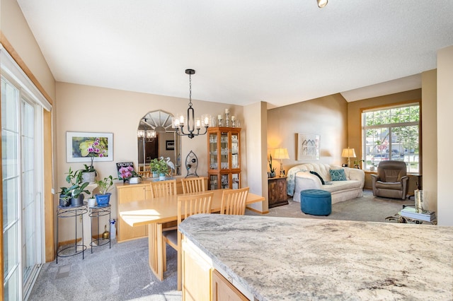 8766 Benson Way Unit 84, Inver Grove Heights, MN 55076 - dining space with light colored carpet, a chandelier, and baseboards