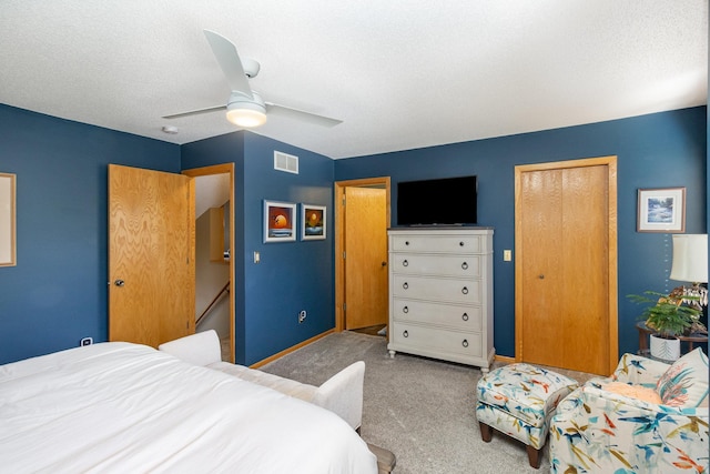8766 Benson Way Unit 84, Inver Grove Heights, MN 55076 - bedroom with carpet, a ceiling fan, a closet, a textured ceiling, and baseboards