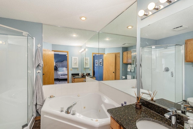 8766 Benson Way Unit 84, Inver Grove Heights, MN 55076 - ensuite bathroom featuring a shower stall, a jetted tub, recessed lighting, and vanity