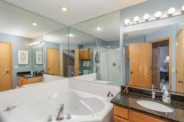 8766 Benson Way Unit 84, Inver Grove Heights, MN 55076 - bathroom featuring a stall shower, a whirlpool tub, vanity, and recessed lighting