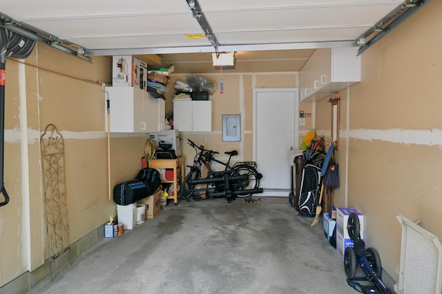 8766 Benson Way Unit 84, Inver Grove Heights, MN 55076 - garage featuring a garage door opener and electric panel
