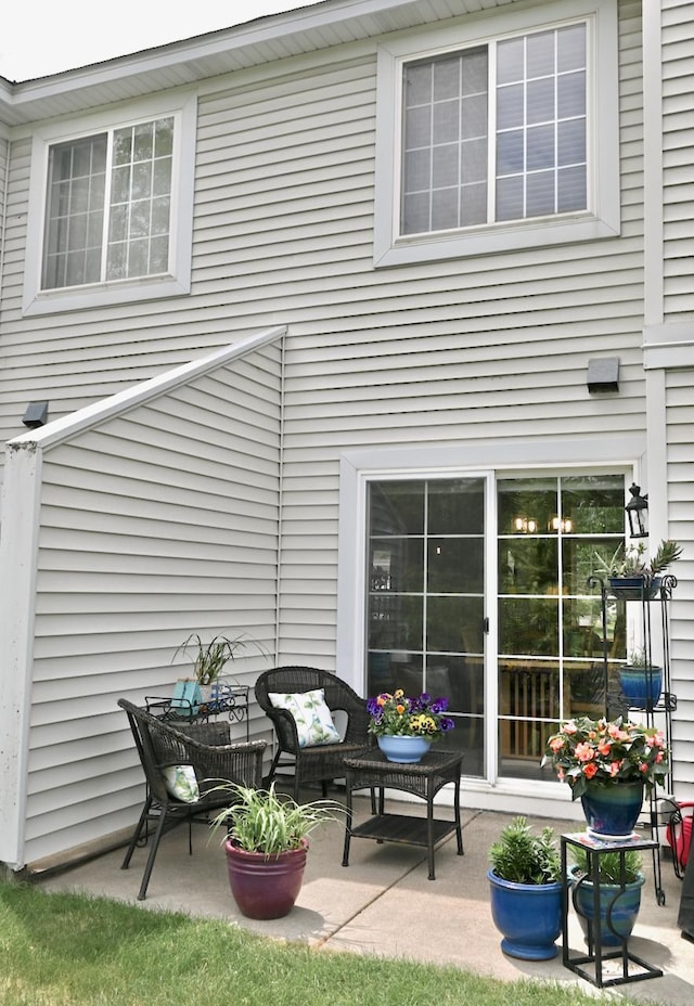 8766 Benson Way Unit 84, Inver Grove Heights, MN 55076 - rear view of property featuring a patio and outdoor lounge area