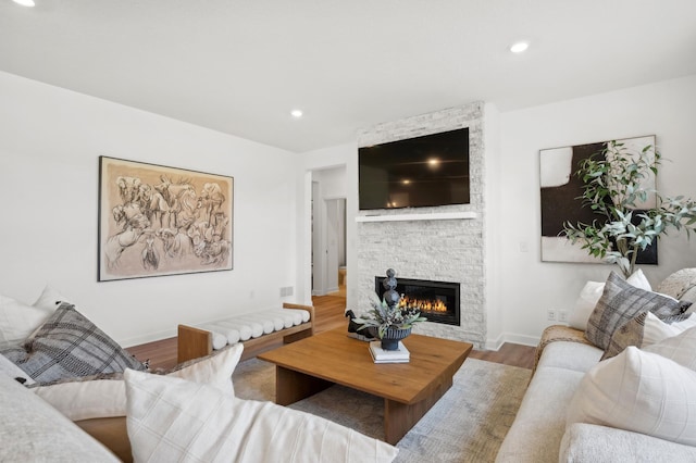 1684 Upper 143rd St E, Rosemount, MN 55068 - living room featuring wood finished floors, a stone fireplace, baseboards, and recessed lighting