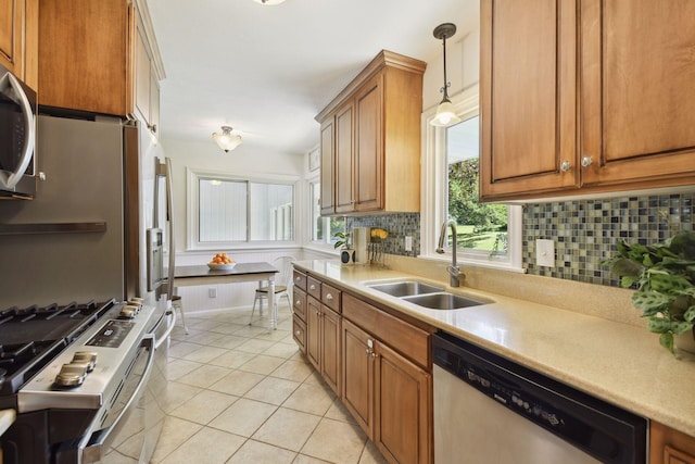 5240 Birch Rd, Minnetonka, MN 55345 - kitchen with appliances with stainless steel finishes, a sink, tasteful backsplash, brown cabinets, and light tile patterned floors