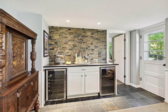 5240 Birch Rd, Minnetonka, MN 55345 - indoor dry bar with wine cooler, tasteful backsplash, recessed lighting, and baseboards