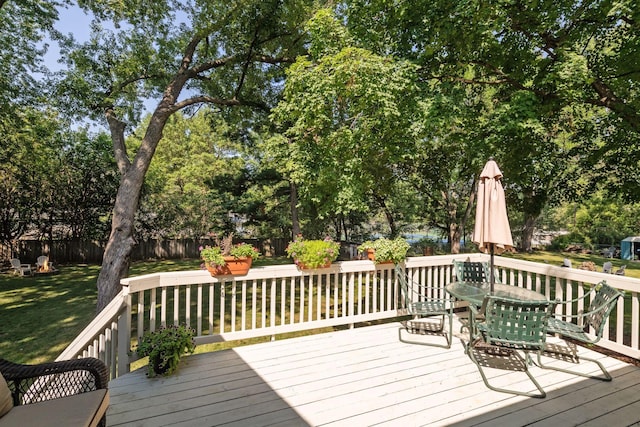 5240 Birch Rd, Minnetonka, MN 55345 - deck with outdoor dining area and view of wooded area