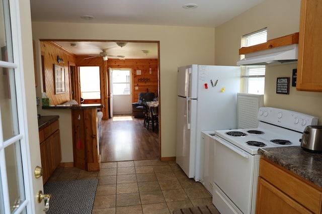 39887 195th St, Clitherall Twp, MN 56524 - kitchen with white appliances, under cabinet range hood, dark countertops, and ceiling fan