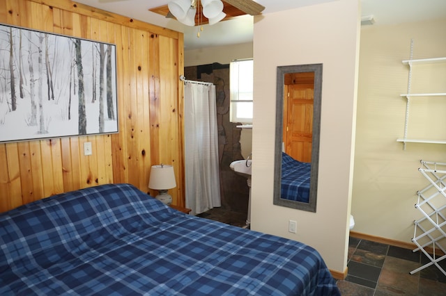 39887 195th St, Clitherall Twp, MN 56524 - bedroom featuring wooden walls and stone finish flooring
