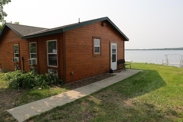 39887 195th St, Clitherall Twp, MN 56524 - view of side of property with a water view, a lawn, cooling unit, and roof with shingles