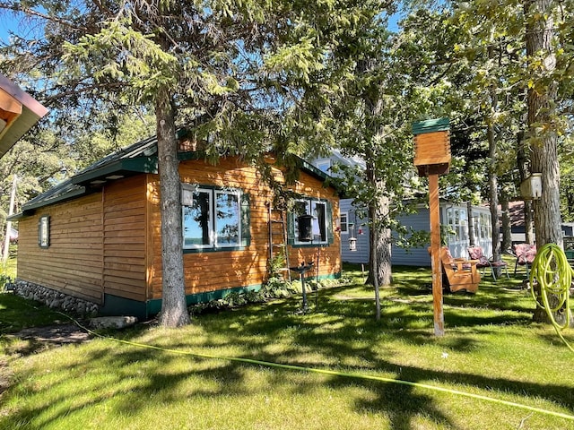 23979 Navajo Trl, Henning, MN 56551 - view of home's exterior featuring a yard