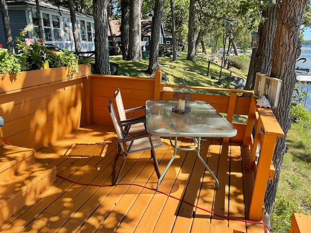23979 Navajo Trl, Henning, MN 56551 - wooden deck with outdoor dining area
