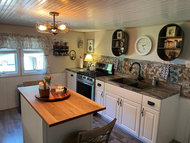 23979 Navajo Trl, Henning, MN 56551 - kitchen with wood counters, a sink, white cabinetry, wooden ceiling, and stainless steel range with gas stovetop