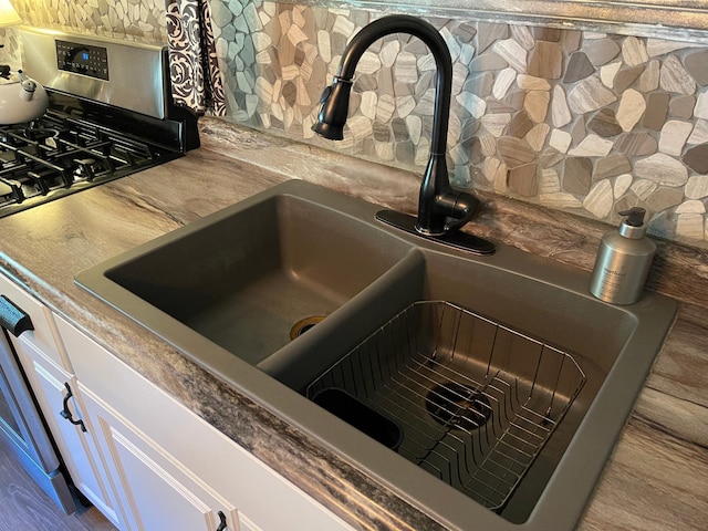 23979 Navajo Trl, Henning, MN 56551 - kitchen view of a sink and stainless steel range with gas stovetop