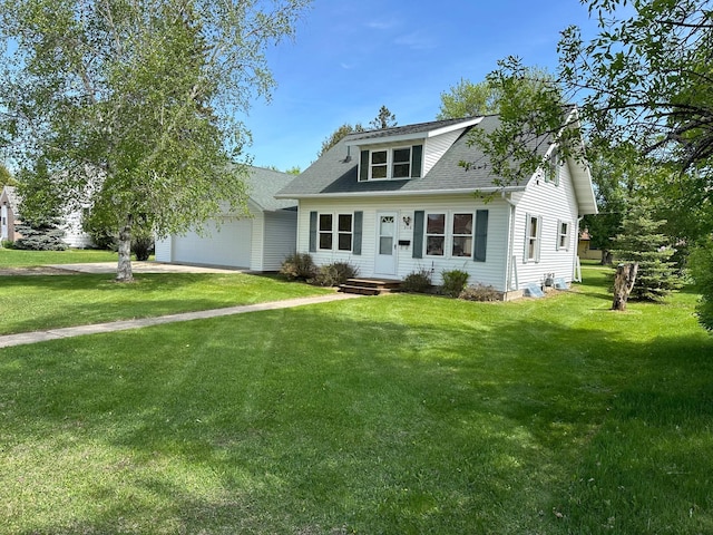 310 7th Ave NE, Roseau, MN 56751 - view of front of property featuring a garage, a front yard, roof with shingles, and driveway