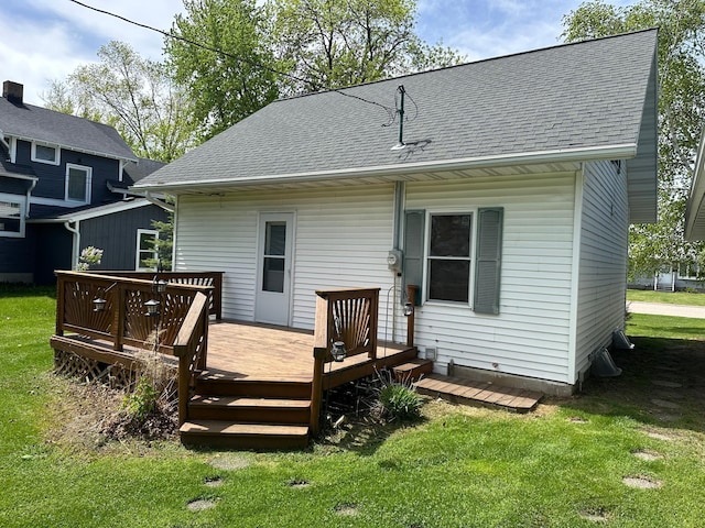 310 7th Ave NE, Roseau, MN 56751 - back of house with a yard, a wooden deck, and a shingled roof