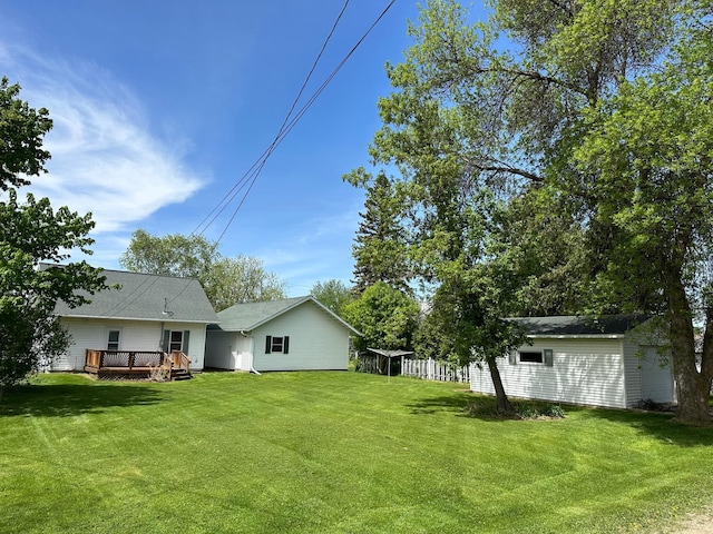 310 7th Ave NE, Roseau, MN 56751 - view of grassy yard featuring a deck