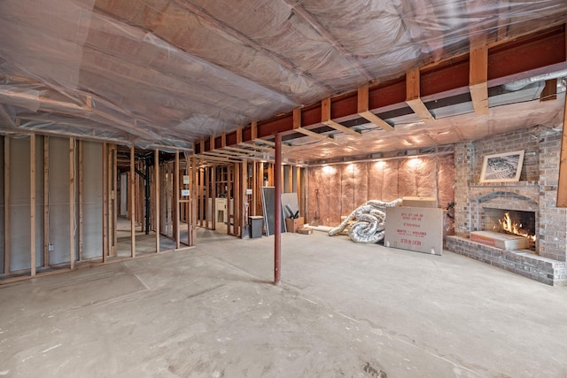 4277 Oakmede Ln Unit 62C, White Bear Twp, MN 55110 - unfinished basement featuring a brick fireplace