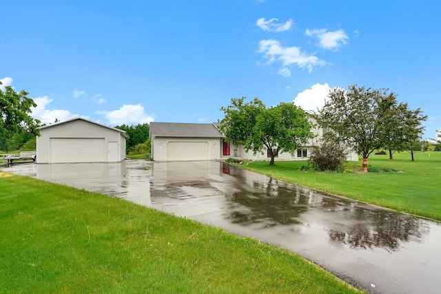 110 Whitetail Ln, Foreston, MN 56330 - view of front of property featuring a garage, a front yard, and an outdoor structure