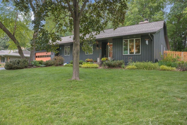 4744 Westgate Rd, Minnetonka, MN 55345 - ranch-style house with board and batten siding, a chimney, an attached garage, and a shingled roof