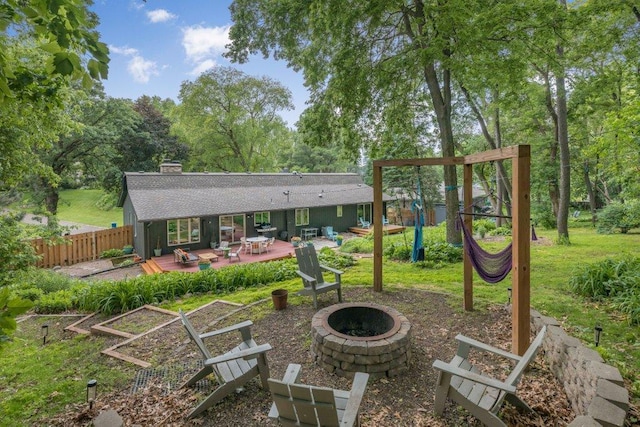 4744 Westgate Rd, Minnetonka, MN 55345 - back of house featuring an outdoor fire pit, a deck, a chimney, and roof with shingles