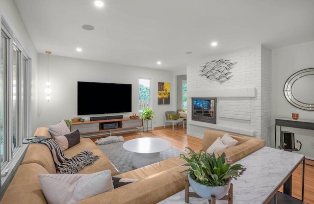 4744 Westgate Rd, Minnetonka, MN 55345 - living area with wood finished floors, a brick fireplace, and recessed lighting