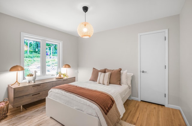 4744 Westgate Rd, Minnetonka, MN 55345 - bedroom with light wood-style floors and baseboards