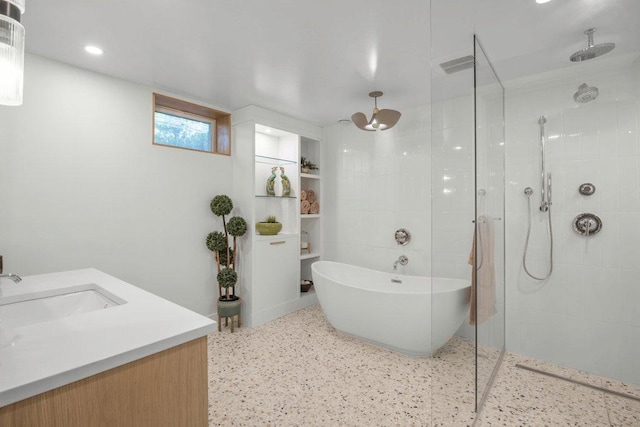 4744 Westgate Rd, Minnetonka, MN 55345 - full bathroom featuring walk in shower, speckle patterned floor, a freestanding tub, vanity, and recessed lighting