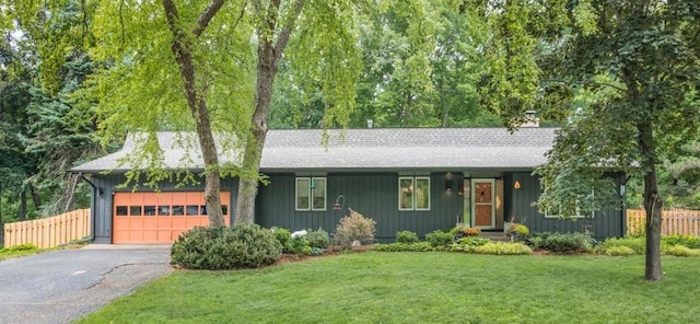 4744 Westgate Rd, Minnetonka, MN 55345 - single story home featuring an attached garage, asphalt driveway, roof with shingles, and board and batten siding