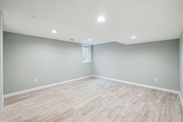 5078 Vine Hill Rd, Deephaven, MN 55331 - below grade area featuring light wood finished floors, recessed lighting, and baseboards