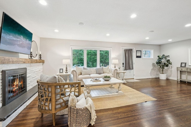 5078 Vine Hill Rd, Deephaven, MN 55331 - living room featuring a stone fireplace, recessed lighting, wood finished floors, and baseboards