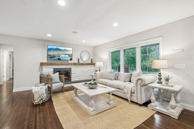 5078 Vine Hill Rd, Deephaven, MN 55331 - living area featuring baseboards, recessed lighting, a glass covered fireplace, and wood finished floors