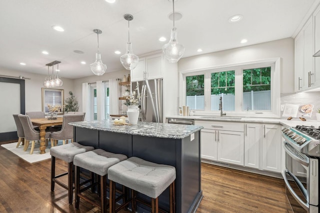 5078 Vine Hill Rd, Deephaven, MN 55331 - kitchen with a sink, stainless steel appliances, recessed lighting, and white cabinets