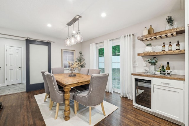 5078 Vine Hill Rd, Deephaven, MN 55331 - dining space featuring wine cooler, a bar, dark wood-style floors, recessed lighting, and baseboards