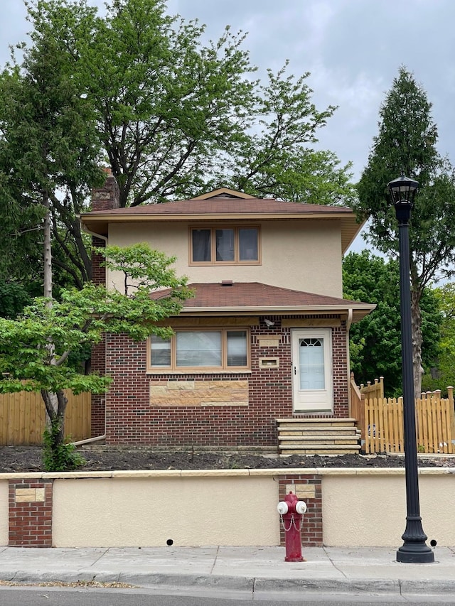 3257 Penn Ave N, Minneapolis, MN 55412 - view of front of home with brick siding, stucco siding, and entry steps