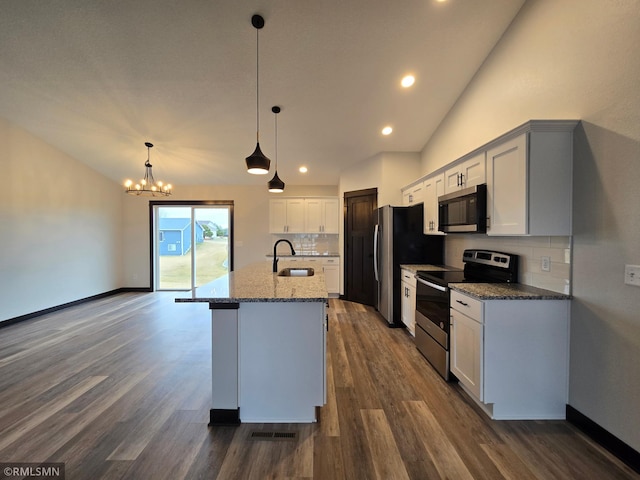 320 Gloria Dr, Green Isle, MN 55338 - kitchen featuring appliances with stainless steel finishes, a sink, backsplash, stone countertops, and dark wood finished floors