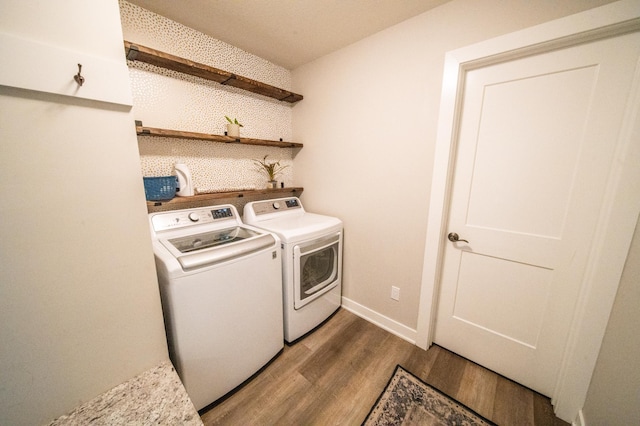 1004 Blanch Ct, Mantorville, MN 55955 - laundry room featuring washer and dryer, wood finished floors, and baseboards