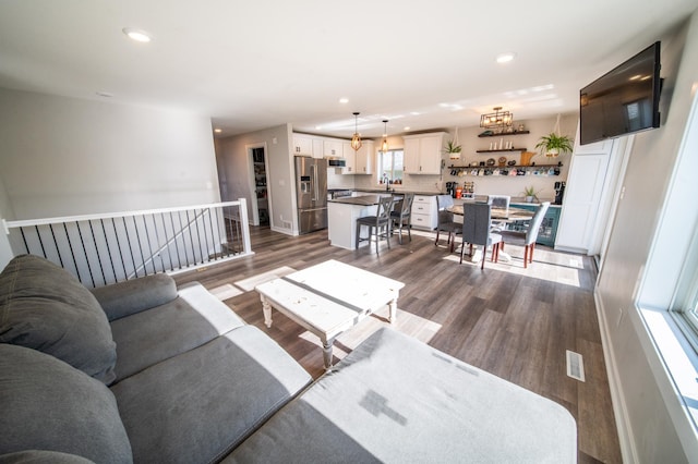 1004 Blanch Ct, Mantorville, MN 55955 - living room featuring dark wood-style flooring, recessed lighting, and baseboards