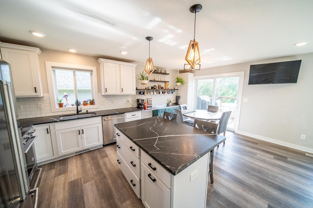 1004 Blanch Ct, Mantorville, MN 55955 - kitchen featuring stainless steel appliances, plenty of natural light, decorative backsplash, dark wood finished floors, and recessed lighting