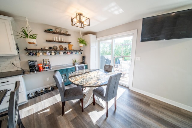 1004 Blanch Ct, Mantorville, MN 55955 - dining space with wood finished floors, a chandelier, and baseboards
