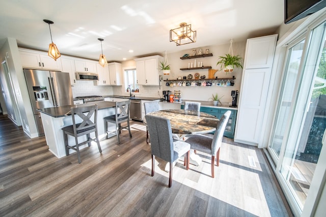 1004 Blanch Ct, Mantorville, MN 55955 - dining room featuring dark wood-style flooring, recessed lighting, and a chandelier