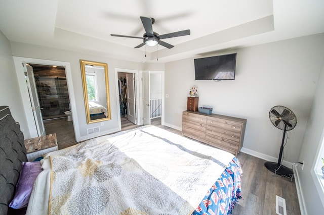 1004 Blanch Ct, Mantorville, MN 55955 - bedroom featuring a raised ceiling, wood finished floors, baseboards, and a spacious closet